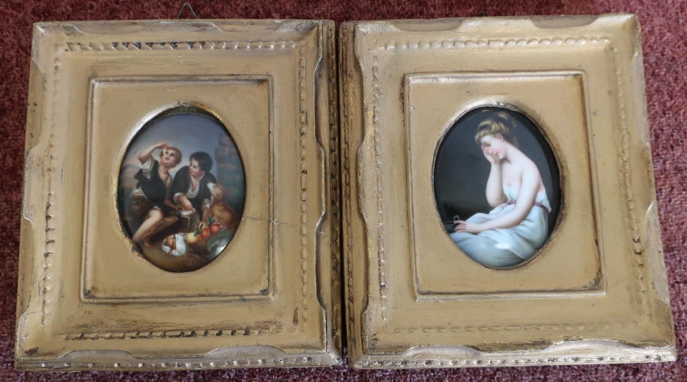 Pair of gilt framed oval porcelain miniatures, one depicting semi nude lady, the other of boys and