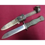 Military sheath knife with 5 1/4 inch blade, composite grip, complete with steel scabbard and