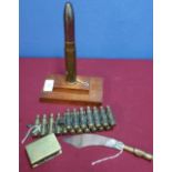 1919 trench art matchbox cover, similar paper knife, small belt of machine gun casings and a mounted