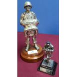 Two military silver plated statuettes, one of a WWII American paratrooper (height 21cm), another