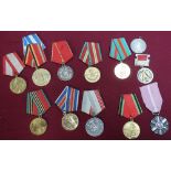 Collection of various foreign medals including Polish long service medal, and a large selection of