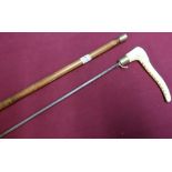 Early to mid 20th C sword cane with carved antler grip and 28 inch octagonal form blade (replacement