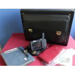 Commercial flight pilots case with large selection of accessories including a Garmin GPS map 296