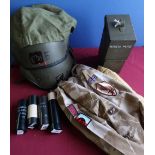 Two British military vehicle driver/commander helmets, four inert baton rounds, canvas slip, Royal