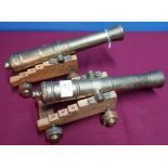 Pair of quality bronze cannon models with 11 inch staged barrels on oak carriages