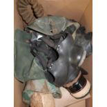 Collection of WWII and later gas masks including British issue haversacks etc (for display