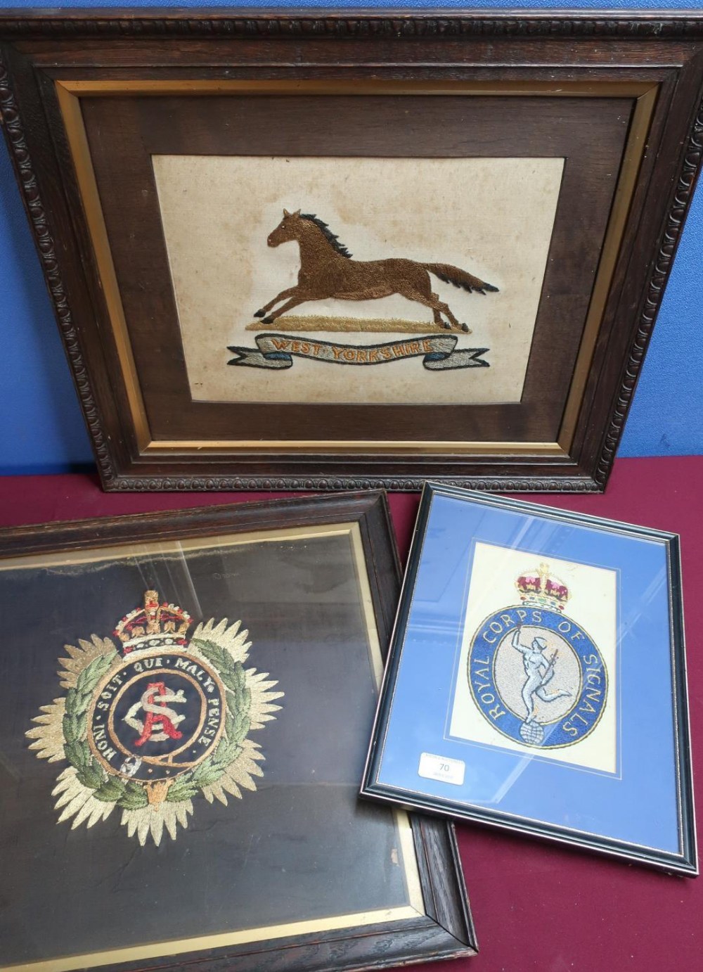 Group of three framed and mounted embroidered regimental crests including Royal Corps of Signals,