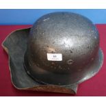 German WWII period fireman's helmet with original leather lining, straps and leather neck protector