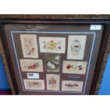 Framed and mounted display of WWI embroidered postcards including 'United We Stand', '1915