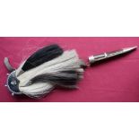Scottish crested horse hair sporran with white hair backing and two black tassels with white