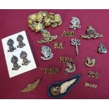 Collection of various military badges including AG cloth RAF badge, various gilt naval buttons,
