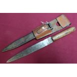 c.WWI Austria Hungarian trench knife complete with sheath leather frog and two piece wooden grips