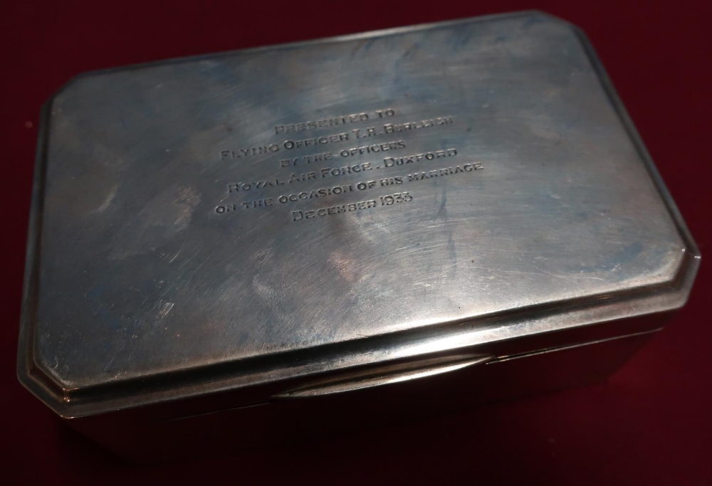 Silver hallmarked presentation cigarette box (marks worn) inscribed "Presented to Flying Officer
