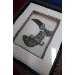 Framed and mounted small jambiya dagger with white metal overlay detail in fitted display case