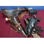 Reproduction Colt style pistol and tooled leather holster and another similar, and a pair of spurs