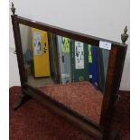 19th C mahogany framed free standing mirror with urn shaped finials (55cm x 55cm)