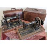 Cased vintage singer sewing machine and another similar (2)