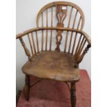 19th C elm stick back Windsor armchair on turned supports, with crinoline understretcher