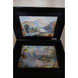 Pair of framed oil on porcelain plaques depicting mountainous landscape scenes, faintly signed lower