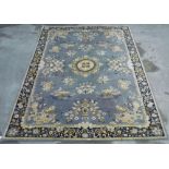 Oriental pattern wool rug, grey ground with floral pattern border (202cm x 297cm)