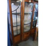 Edwardian mahogany inlaid three tier display cabinet, with central bowfront glazed panel flanked