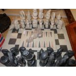 African style carved stone chess set and similar draughts board
