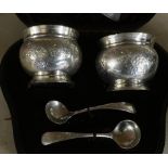 Cased pair of London silver hallmarked salts with blue glass liners and spoons