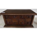 Table cabinet in the form of eight pigeon hole drawers (44.5cm x 22cm x 24cm)