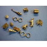 Selection of 13 various assorted silver and unmarked white metal charms from a charm bracelet