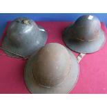 Three WWII British steel helmets, two complete with liners, one marked S.M.LD 1941 (3)