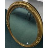 Gilt framed bevelled edge oval wall mirror (83cm x 58cm)