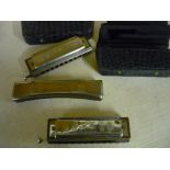 Two cased Hohner Chromonica Harmonica (No 260) and a Hohner Echo Harmonica (3)