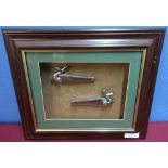 Framed & mounted display of a pair of steel locks for a hammer gun (33cm x 28cm)
