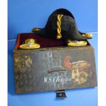 Cased senior Naval officers bicorn hat and epaulettes in fitted and lined japped metal case with
