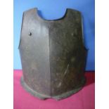 Heavy steel breast plate with bullet shot mark, twin rivets and flange to the base, the front