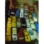 Box containing a selection of various play worn vintage Corgi die-cast vehicles