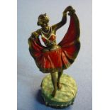 A signed cold painted bronze erotic dancing figure with hinged lift up front skirt (13.5cm high)