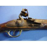 Indian flintlock carbine with 30 1/2 inch barrel with brass mounts and trigger and butt guards,