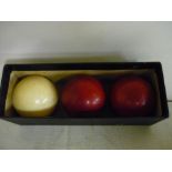Three late 19th C turned and stained ivory billiard balls