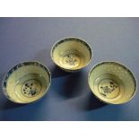 Three Chinese blue & white rice bowls with various signature panels to the base