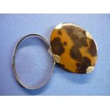 Tortoiseshell and white metal oval magnifying glass with swivel pivot action (9cm x 7cm)