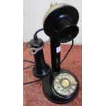 Stick type telephone on circular base