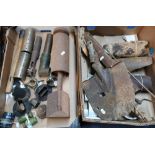 Selection of relic state military items, shrapnel, spade head, bomb tail fins, axe shaft, other