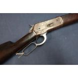 1886 model .40 Winchester rifle with 25 1/4 inch octagonal barrel with adjustable rear sights,