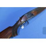 Laurona 12 bore over and under shotgun with 28 inch barrels and 15 inch pistol grip stock, serial