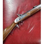 Thompson Centre Arms .54 muzzle loading black powder rifle, serial no. 36735, with a selection of