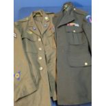 American military tunic with various buttons, badges etc and another American military dress