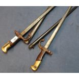 Two 19th C French Gras type bayonets with broad back straps dated 1887 and 1876, complete with steel