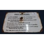 Small rectangular enamel 'Precautions' sign from the underside of a A W BOMBS packing case (30.5cm x