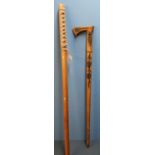 Japanese carved wood training sword (overall length 102cm) and a Native American style carved wood